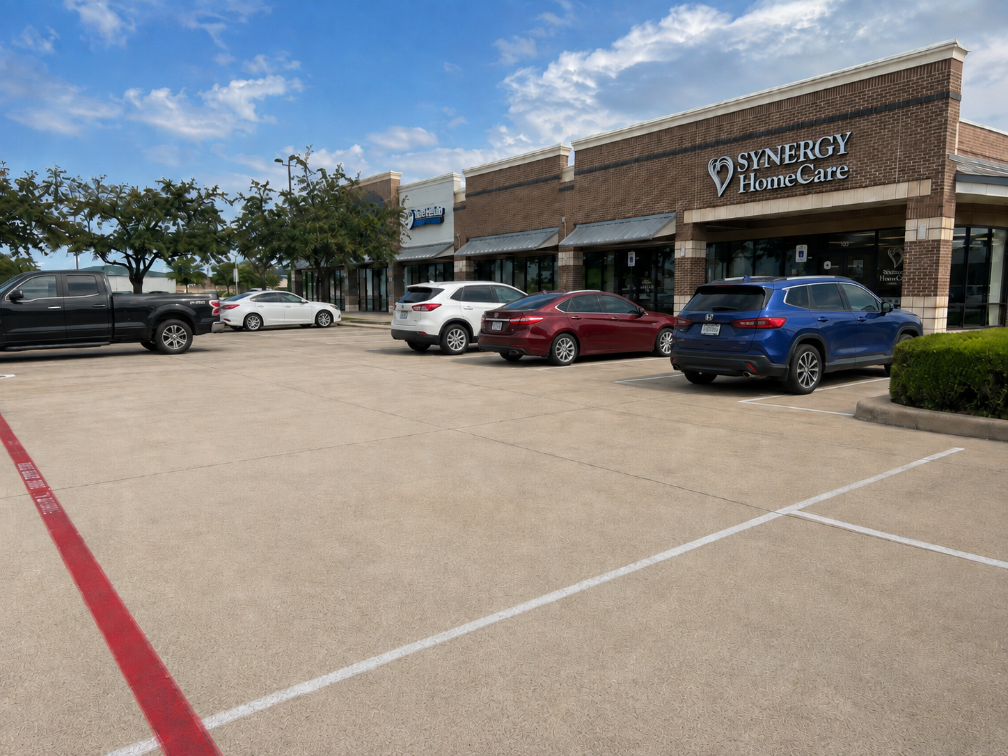Commercial parking lot concrete being cleaned with a rotary surface cleaner